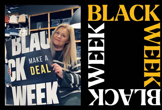 En dame som holder en Black Week-plakat