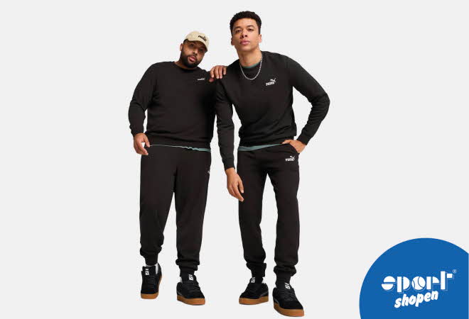 To menn i matchende svart Puma treningssett.