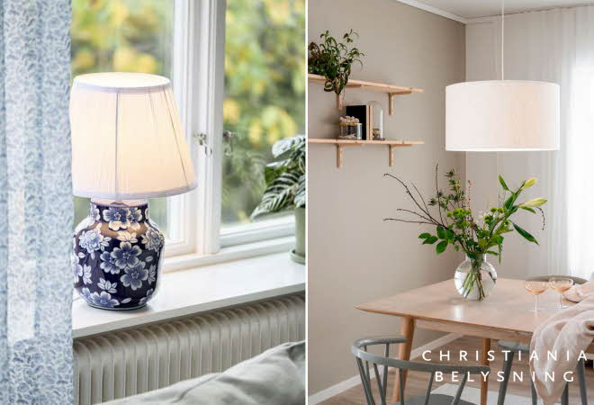 En bordlampe ved et vindu og en spisestue med et trebord.