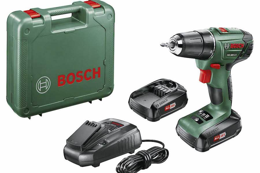 grønn koffert, grønn drill, svart batteri og svart lader