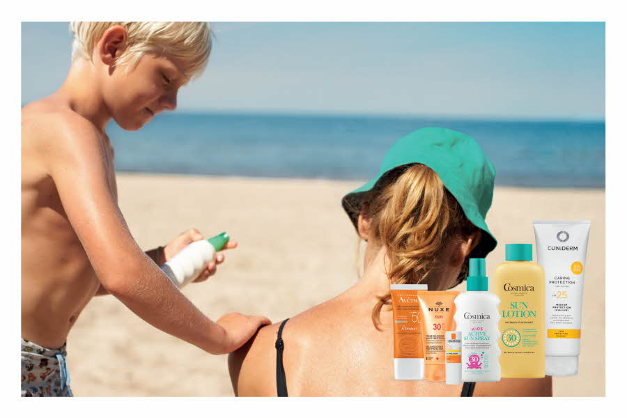 Solpleie produkter med gutt som smører dame inn med solkrem i bakgrunnen