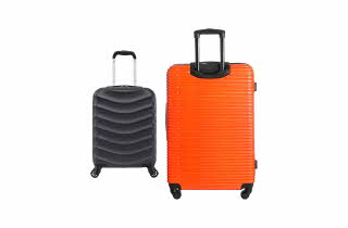 En oransj koffert og en mindre sort koffert