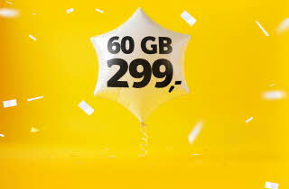 En ballong med teksten "60 GB 299,-" og hvit konfetti på gul bakgrunn.