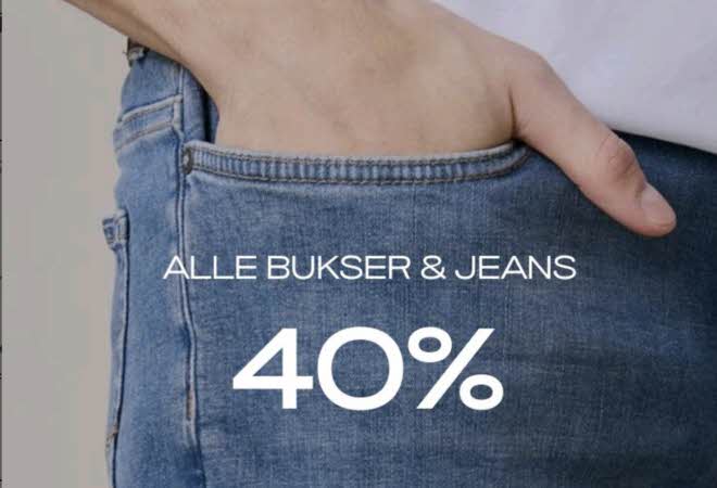 Nærbilde av en hånd som stikkes i lommen på en jeans, med teksten: Alle bukser & jeans 40 %