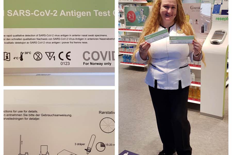 ansatt på apotek viser frem covid test