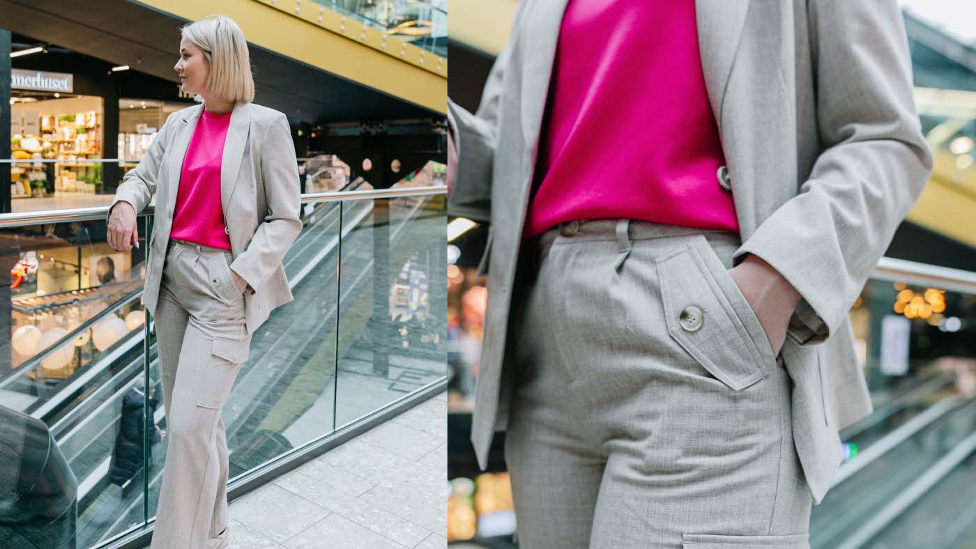 Dame i grå dress og rosa t-skjorte