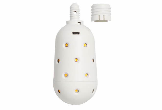 Hvit oppladbar LED-pære med små lysprikker og avtagbar topp.