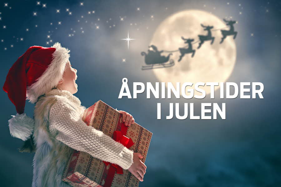 Barn med pakke som ser opp på julenissen i flygende slede