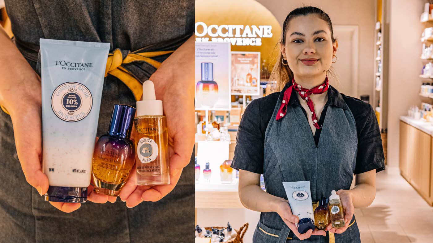Dame fra L'Occitane som holder opp produkter