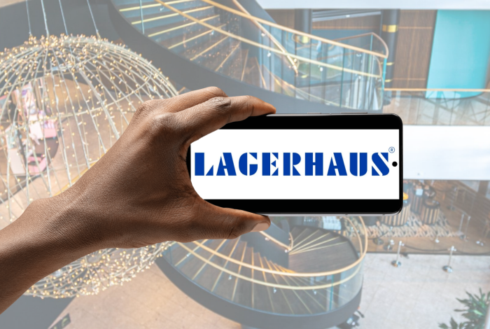 Mobiltelefon med lagerhaus logo på skjermen