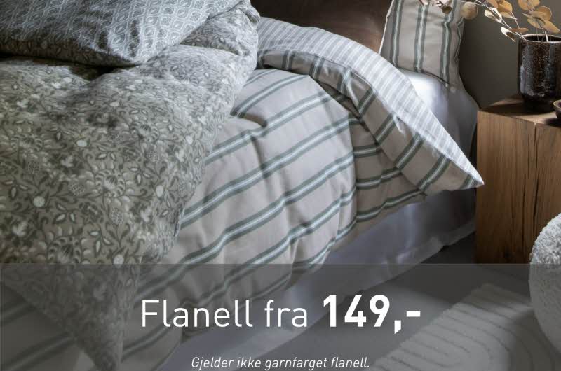 En oppredd seng med tekst "flanell fra 149"